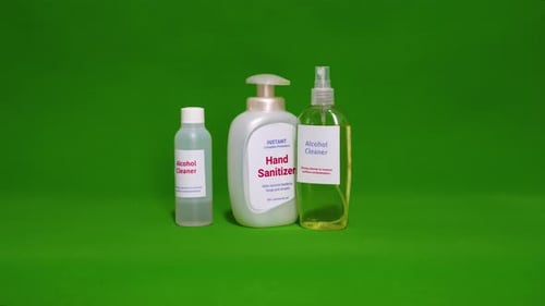 Hand Sanitizers and Alcohol Cleaner Bottles on Green Screen