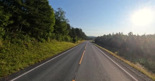 Driving a Car on a Road in Norway.