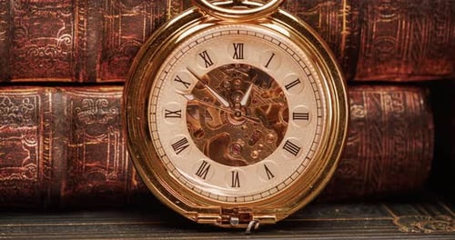 Antique Gold Pocket Watch with Old Books