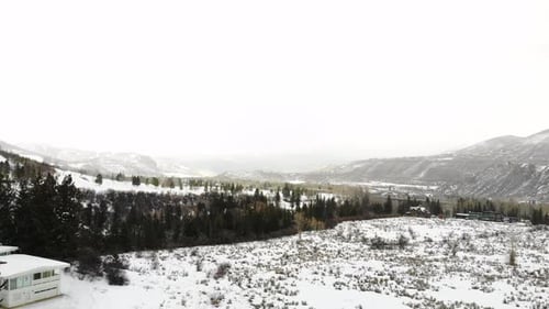 Winterscape Rocky Mountains Valley With Pine Trees And Snow-Covered Field Near Estes Park, Colorado