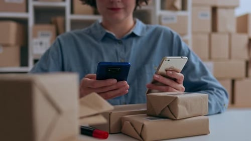 Warehouse Worker Manager Of Telephone Conversations Consulting Customers Sitting In A Warehouse