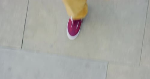Shoes, feet walking and concrete paving for fitness, cardio exercise and travel in city with fashion