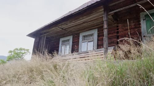 Old Wooden of Hutsul House on Meadow of Carpathian Mountains