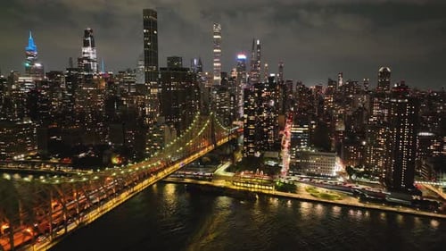 Ed Koch Queensboro Bridge With Manhattan Skyscrapers At Night - Aerial Drone Shot