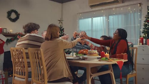 Family Sharing a Toast at Christmas Table