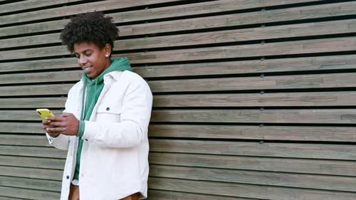Young Adult Using Smartphone in Urban Setting