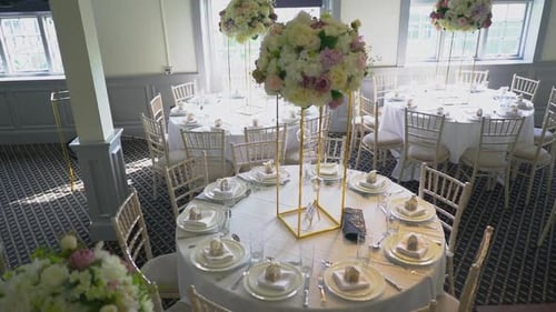 A view of a dinning tables well decorated in a banquet.