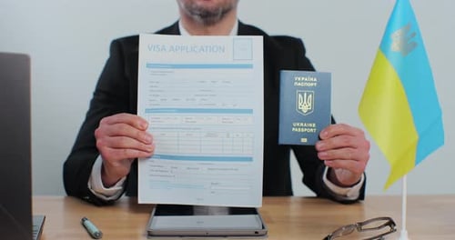 Ukranian Embassy Officer Showing Showing Visa Application and Passport Legal Immigration Tourist