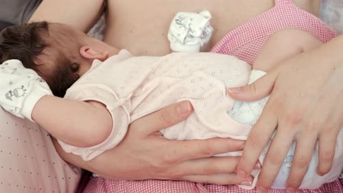 Intimate close up of a mother breastfeeding her baby