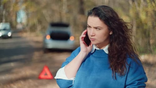A Car Breaks Down on the Road a Woman Calls the Service for Help with Repairs