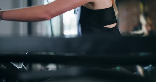 4k video footage of an attractive young sportswoman working out on an exercise bike in a gym