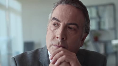 Pensive Senior Male Entrepreneur Thinking about Something Staying in Office