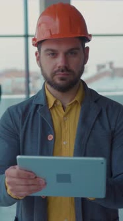 A Construction Worker Effectively Utilizing a Tablet in a Modern Building Environment