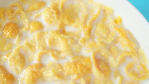 Top view of Appetizing corn flakes mixed with milk