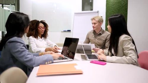 Young Professionals Collaborating in Modern Workplace