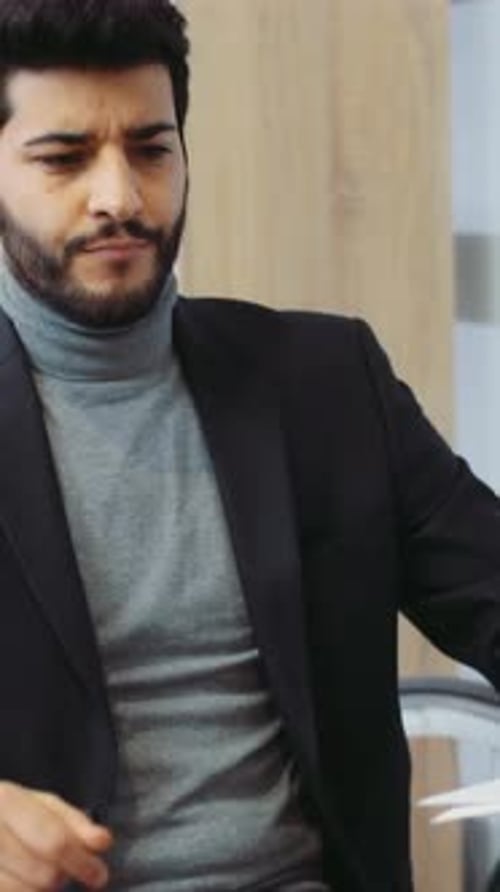 A Businessman in a Suit Engages in Critical Tasks Showing Dedication