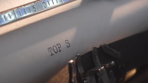 Typewriter Captures the Words Top Secret on Paper in an Office Environment During Daytime Working