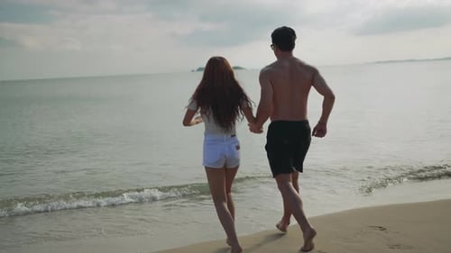 Close up Couple running enjoy life playing and freedom beach