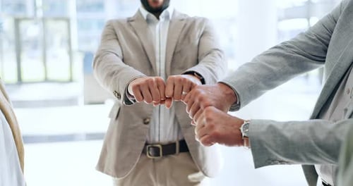 Diverse Team United by Collaborative Fist Bump