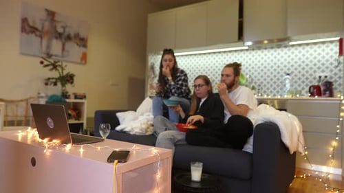 Friends Relaxing Together in Cozy Apartment