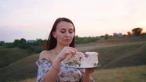 Happy Family with Baby Celebrate First Year Eat Cake in Field at Sunset Autumn and Lifestyle