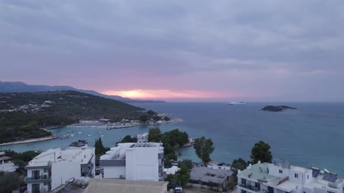 Sunset aerial over idyllic holiday destination in Mediterranean - Ksamil
