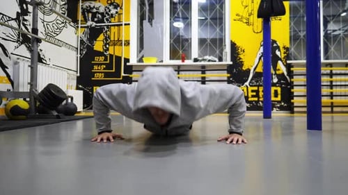 Strong Sportsperson Doing Push Ups at Fitness Club Muscular Sportsman Showing Hard and Intense