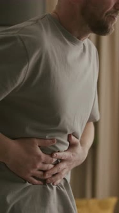 Adult Male Experiencing Stomach Pain