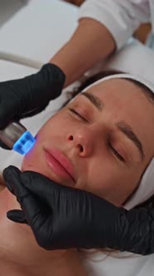 Woman Receiving Blue Light Beauty Treatment