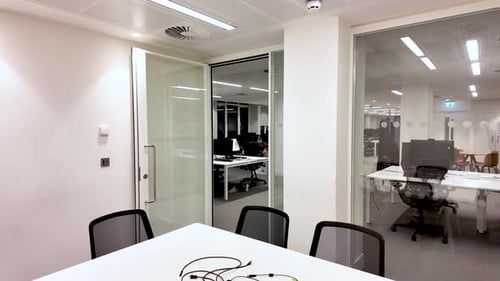 Modern Empty Meeting Room Interior With White Table And Chairs Open Glass Door To Office Space With
