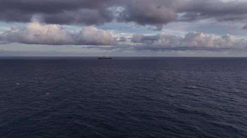 Serene Ocean with Distant Ship Calm Horizon Featuring Faraway