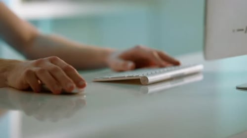 Unrecognized man hands scrolling mouse wireless device at office desk close up