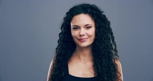Close Up of Woman with Curly Hair Smiling