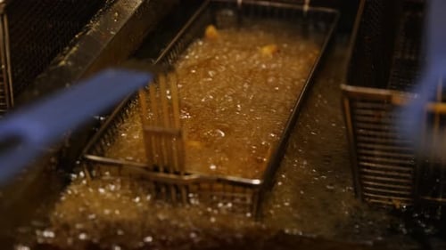 Fast Food Restaurant Deep Frying French Fries in Oil