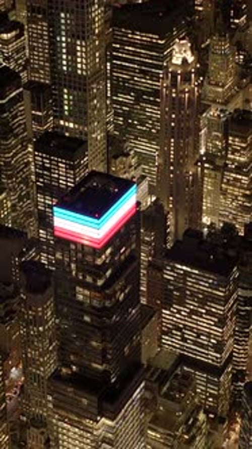 A Breathtaking Aerial Night View Showcases a Vibrant City Skyline Full of Life and Lights
