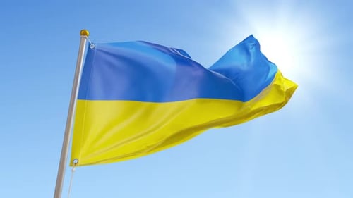 Blue and Yellow Flag Waving Against Bright Sky