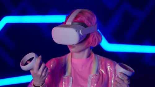 A Young Woman Wearing a VR Helmet and Playing a Game Cyber Player in a Virtual Reality Tournament