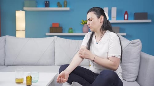 Woman with itchy arms.