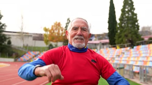 Active Senior Man Warming Up Before Exercise