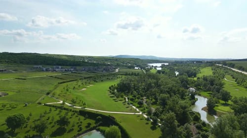 Landscape of Nature Concept Aerial View of the River Quadcopter Flying Over a Green Field During