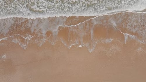 Ocean waves breaking on a rocky shore, Aerial view