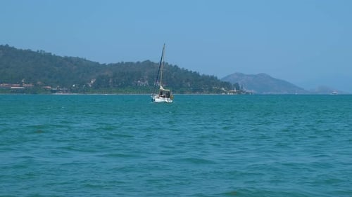 Alone Traveling Yacht on Windy Waves