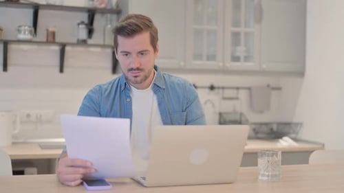 Man Receives Good News While Working at Home
