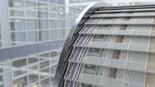 Close Up View to Conveyor Belt with Fresh Newspapers with Printed Latest News