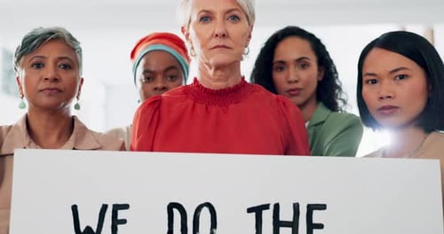 Face, poster and equal pay with a business woman team holding a sign in their office at work