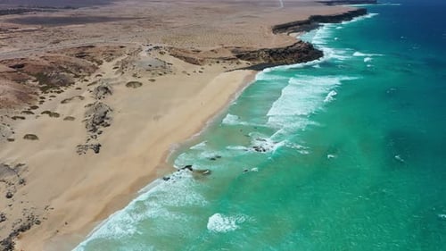 Aerial Drone View of Kitesurfers and Surfers at Playa del Castillo, Fuerteventura, Canary Islands