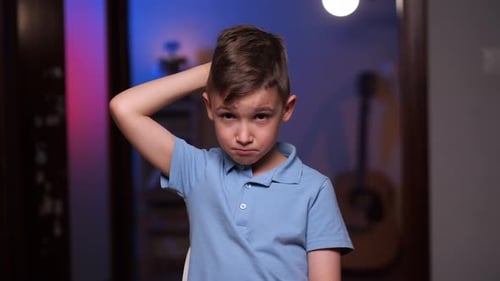 Thoughtful Boy With Hand on Head