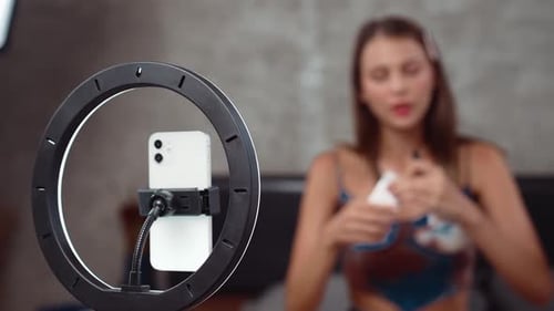 Young Brunette Woman Recording Beauty Tutorial at Home