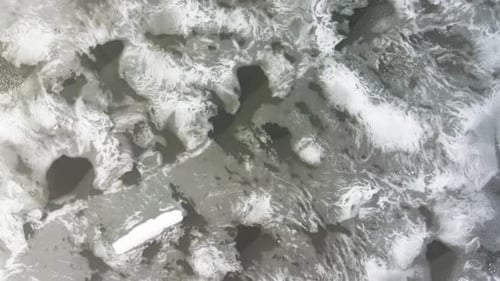 Vertical facing spin over intricate patterns in lake ice.