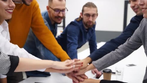Enthusiastic Team Celebrating Success in Modern Office